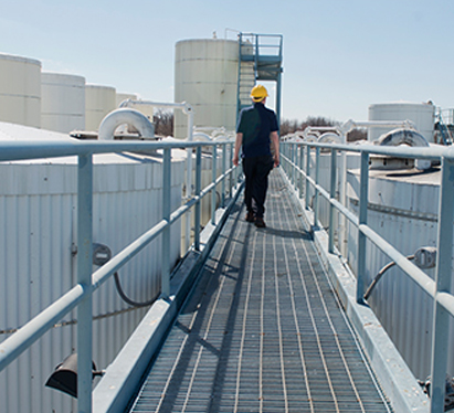 Plant worker in catwalk